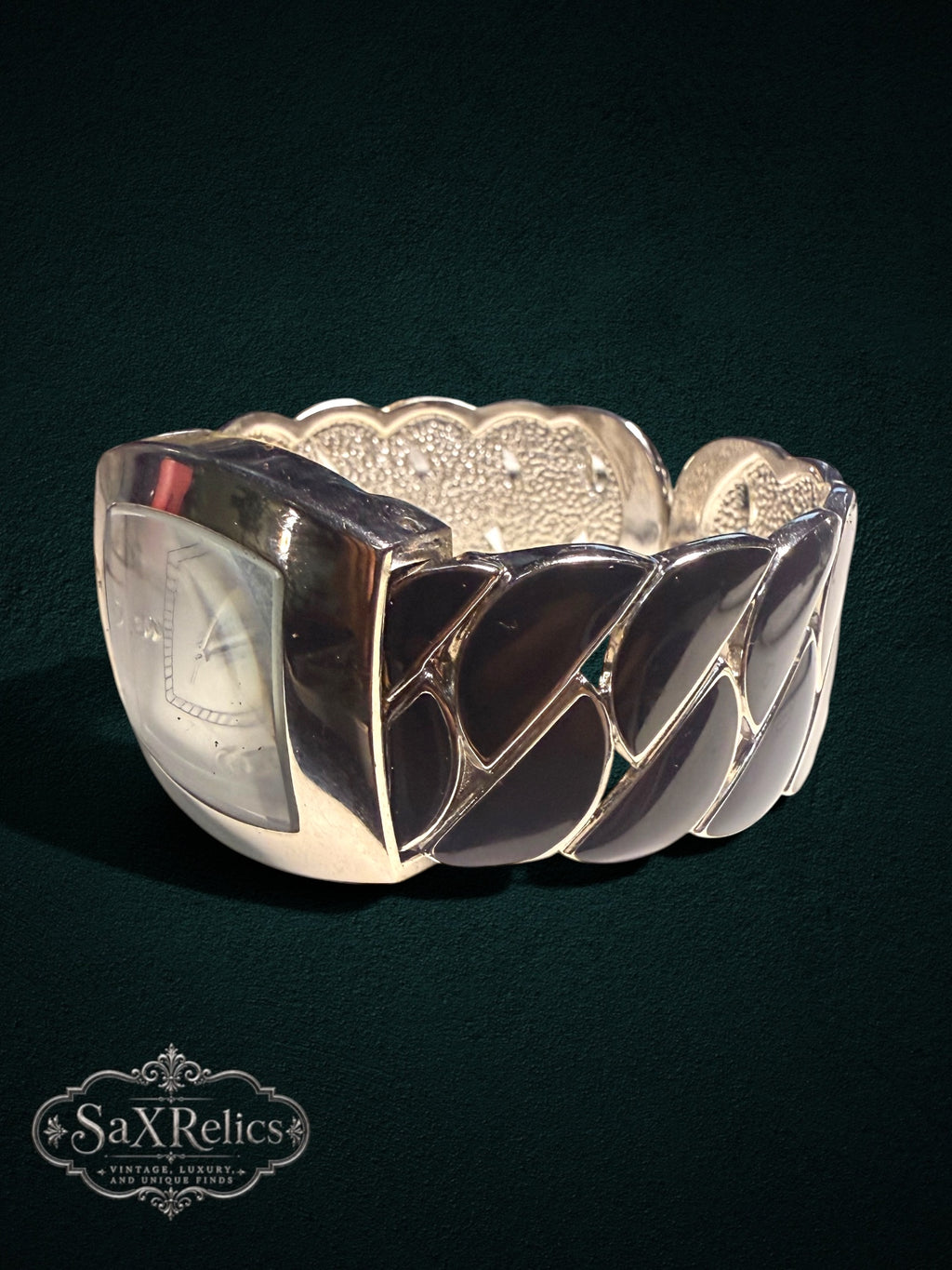 My Store GENEVA quartz wristwatch featuring a silver-tone rectangular case and a wide, sculptural cuff bracelet.