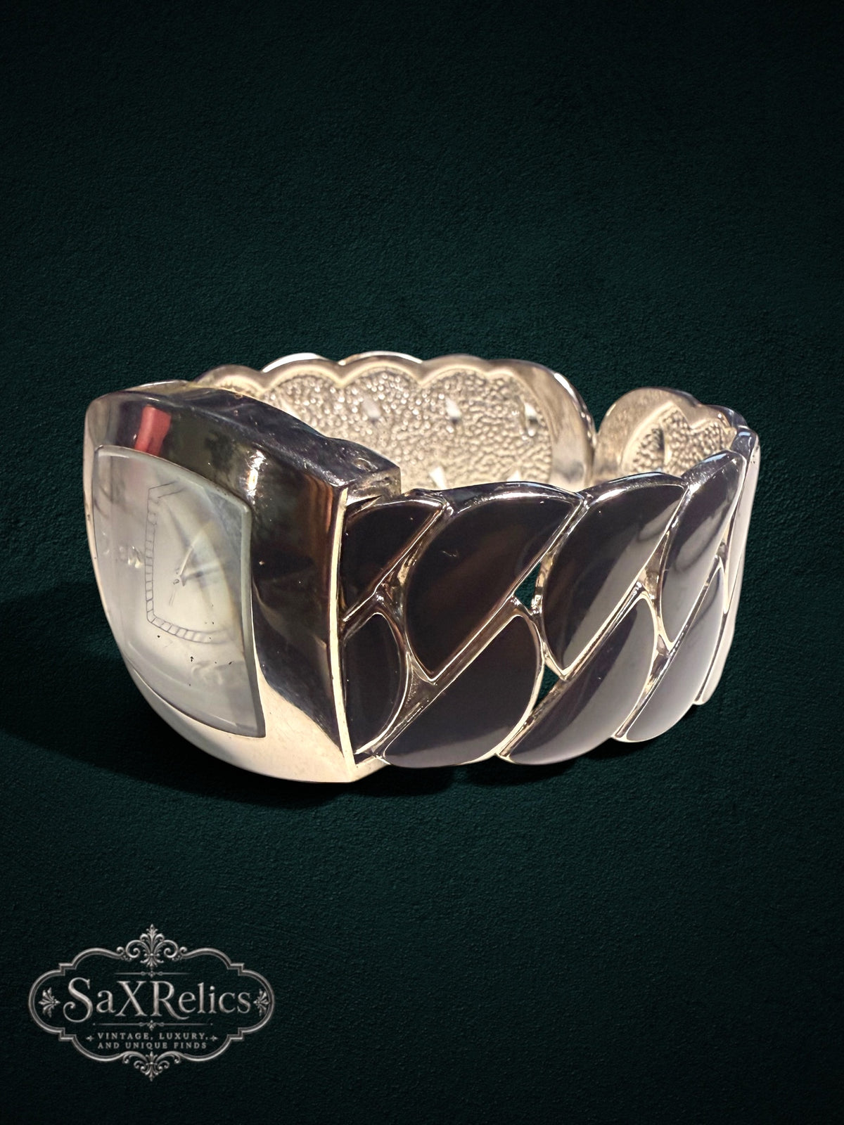 My Store GENEVA quartz wristwatch featuring a silver-tone rectangular case and a wide, sculptural cuff bracelet.