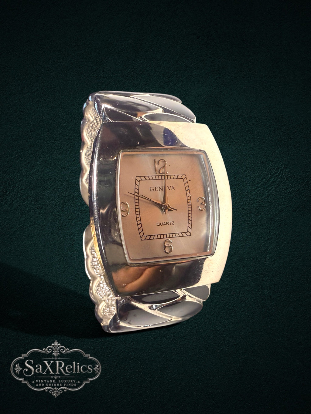 My Store Geneva quartz wristwatch featuring a rectangular face and a wide, sculptural silver-tone cuff bracelet.