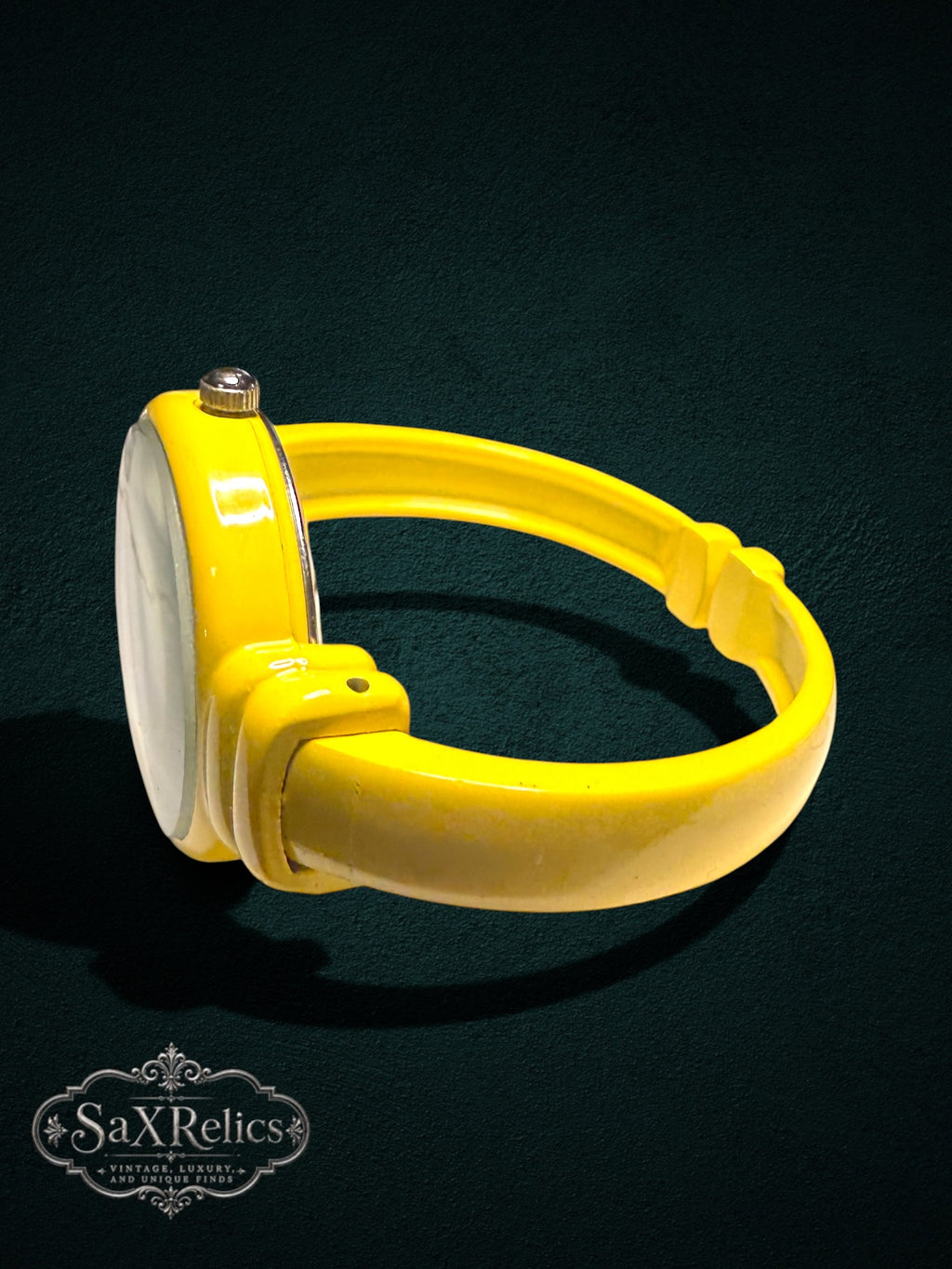 My Store Geneva analog wristwatch featuring a vibrant yellow open-cuff bangle bracelet and a minimalist white dial.