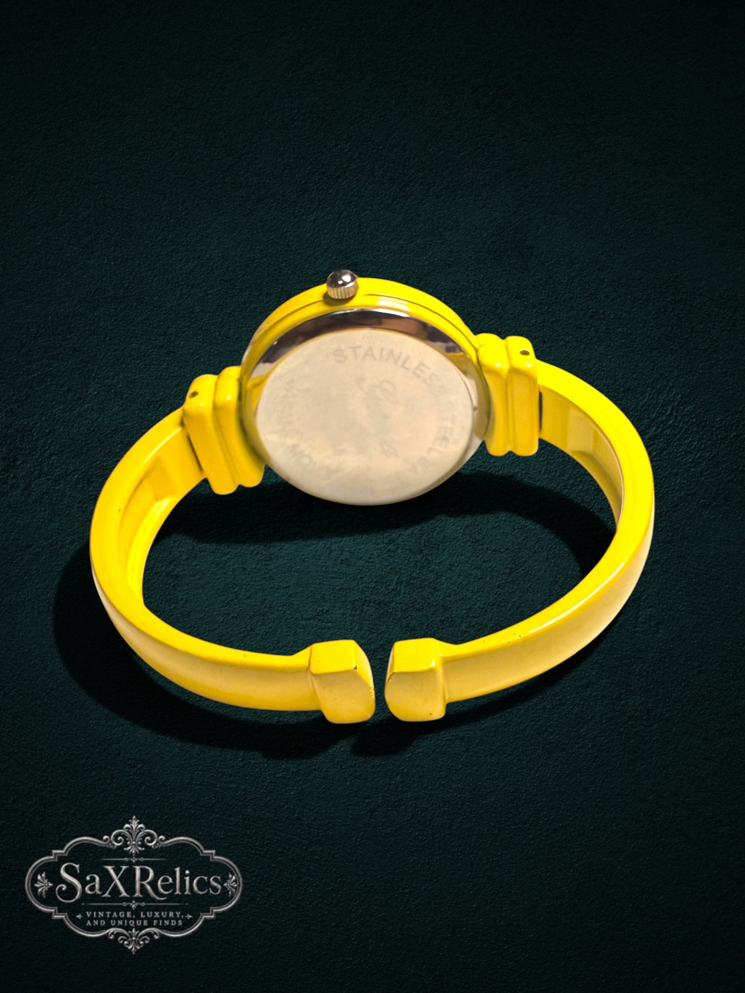 My Store Geneva yellow bangle watch with a polished stainless steel case back and open-cuff design