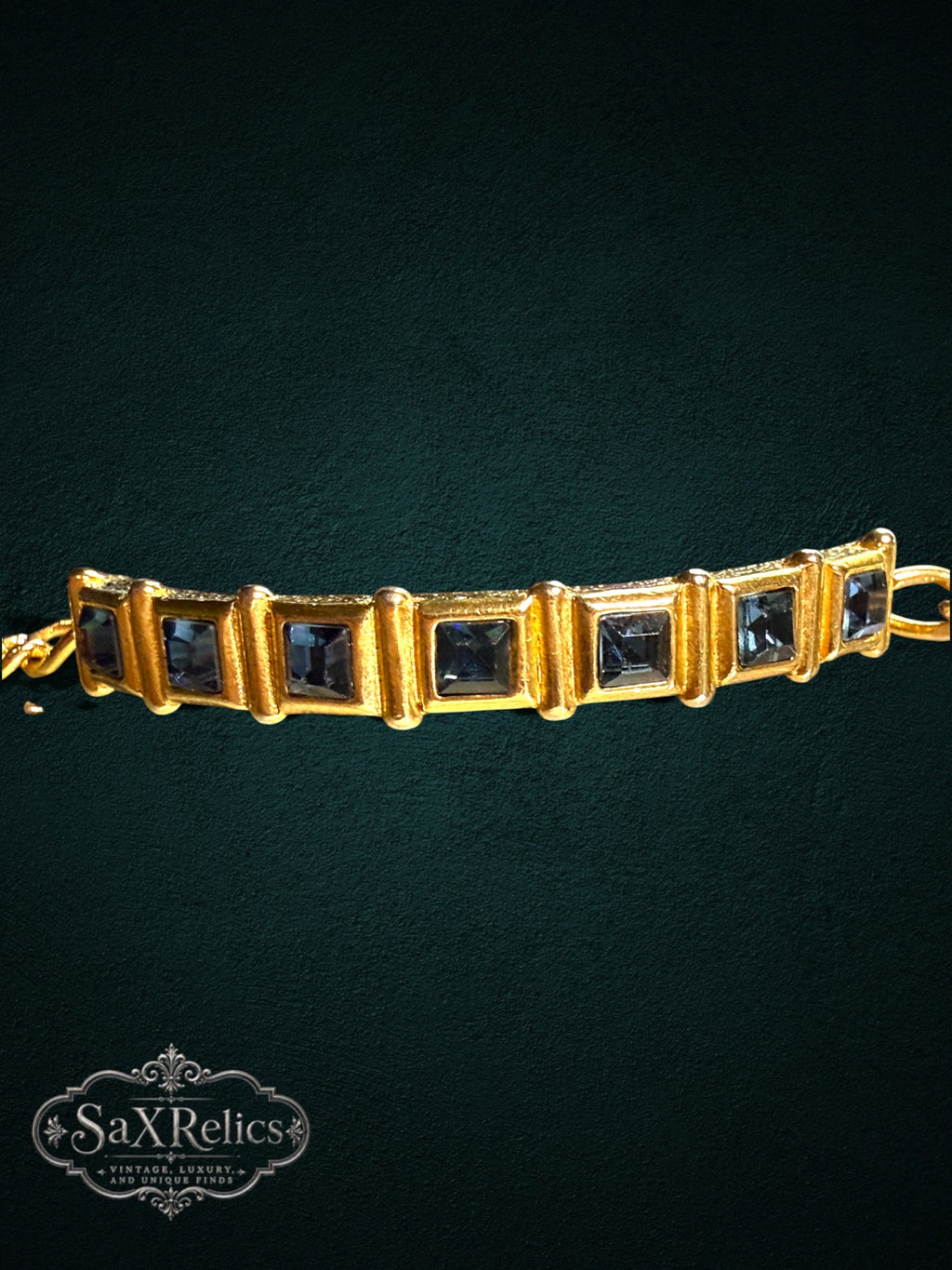SaX Relics gold-tone link bracelet featuring square-cut midnight-blue stones in a textured vintage frame.