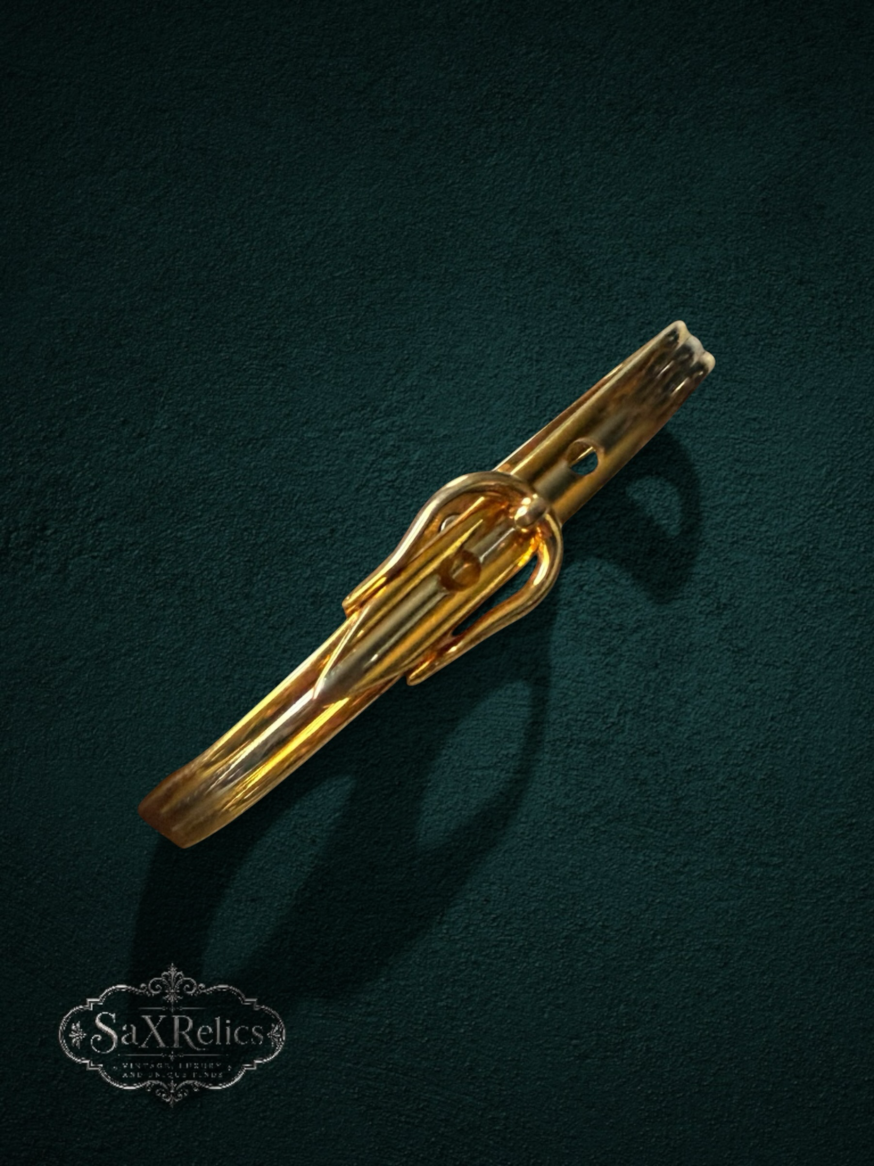 My Store 24K gold-finish bangle bracelet featuring a vintage-inspired buckle design and secure magnetic closure.