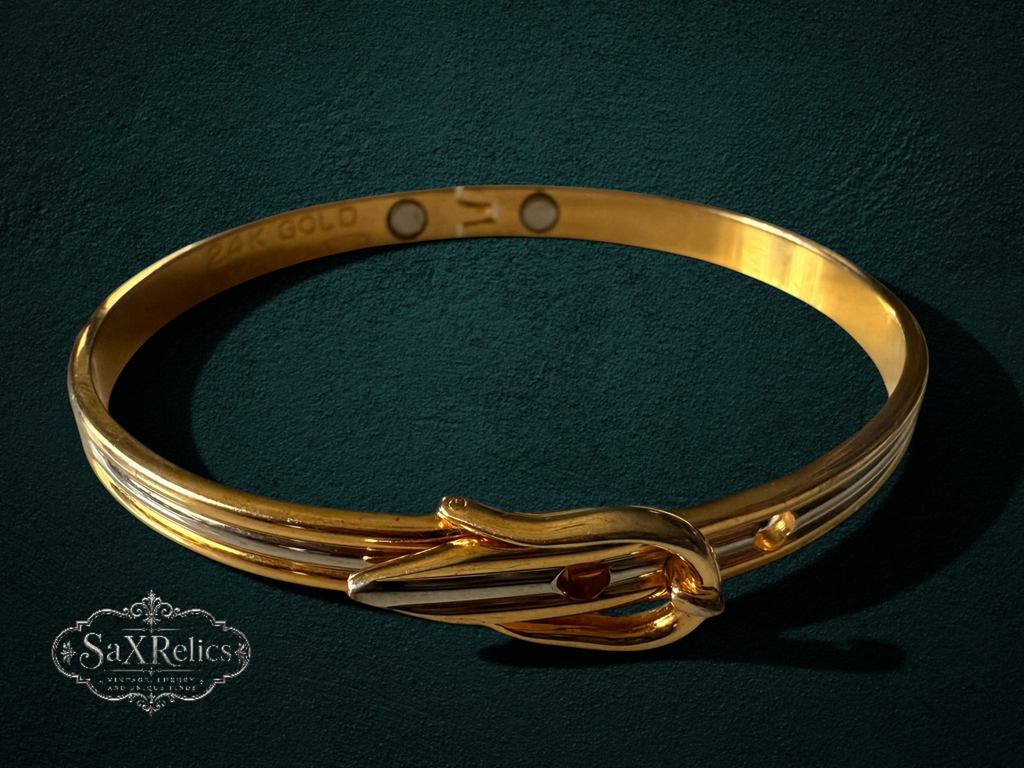 My Store 24K gold-plated bangle bracelet featuring a vintage-inspired buckle design and magnetic closure.