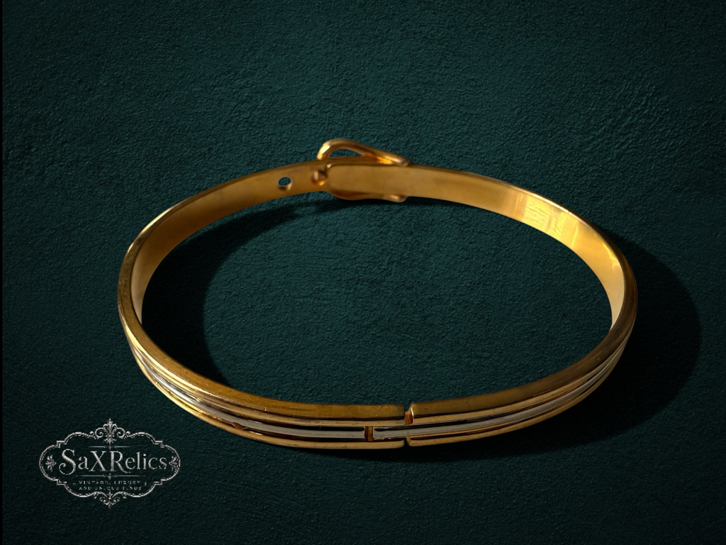 My Store 24K gold-finish bangle bracelet with a vintage-inspired buckle design and secure magnetic closure.