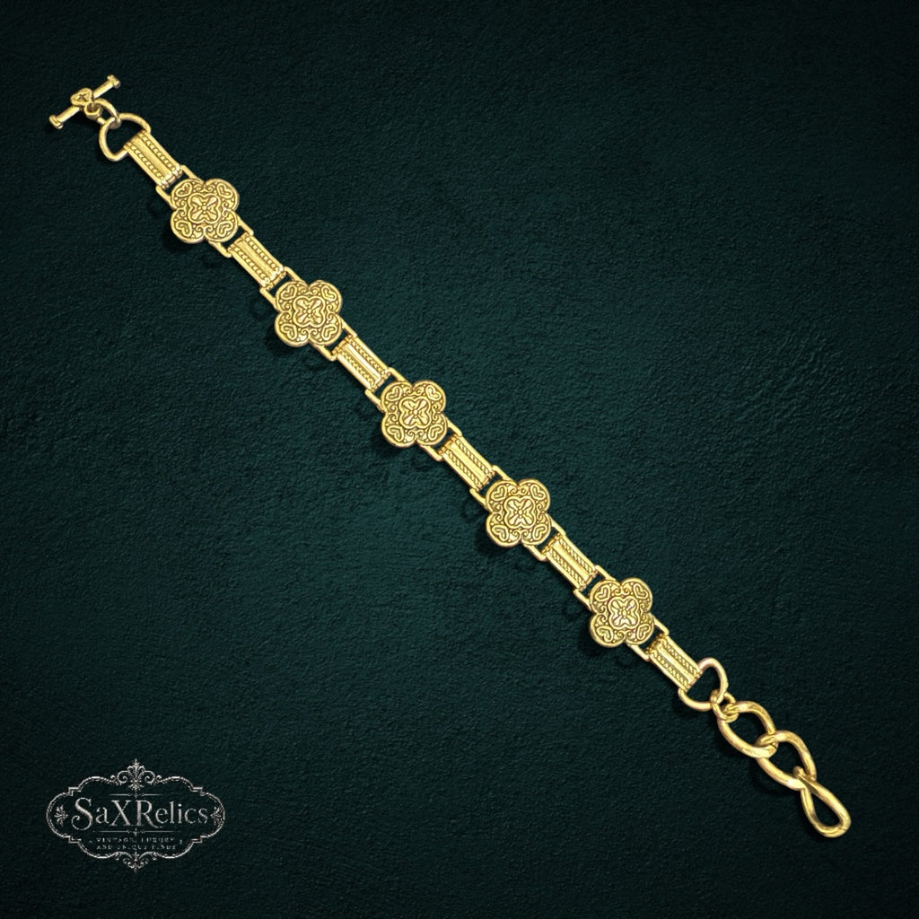 SaX Relics Brighton silver-plated clover link bracelet with toggle clasp on a dark background