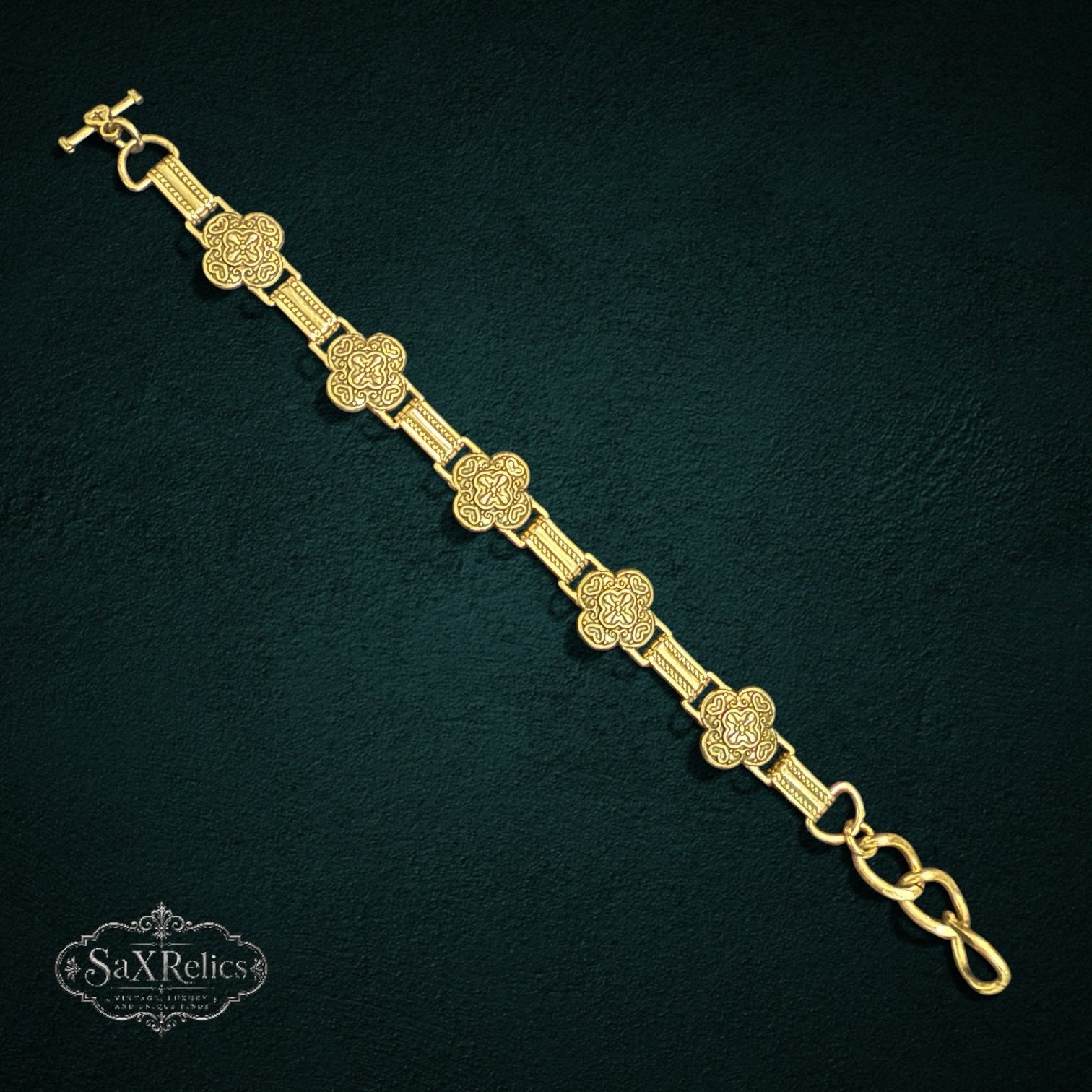 SaX Relics Brighton silver-plated clover link bracelet with toggle clasp on a dark background