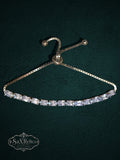 My Store gold-tone tennis bracelet with clear oval-cut crystals and an adjustable bolo-style sliding clasp.