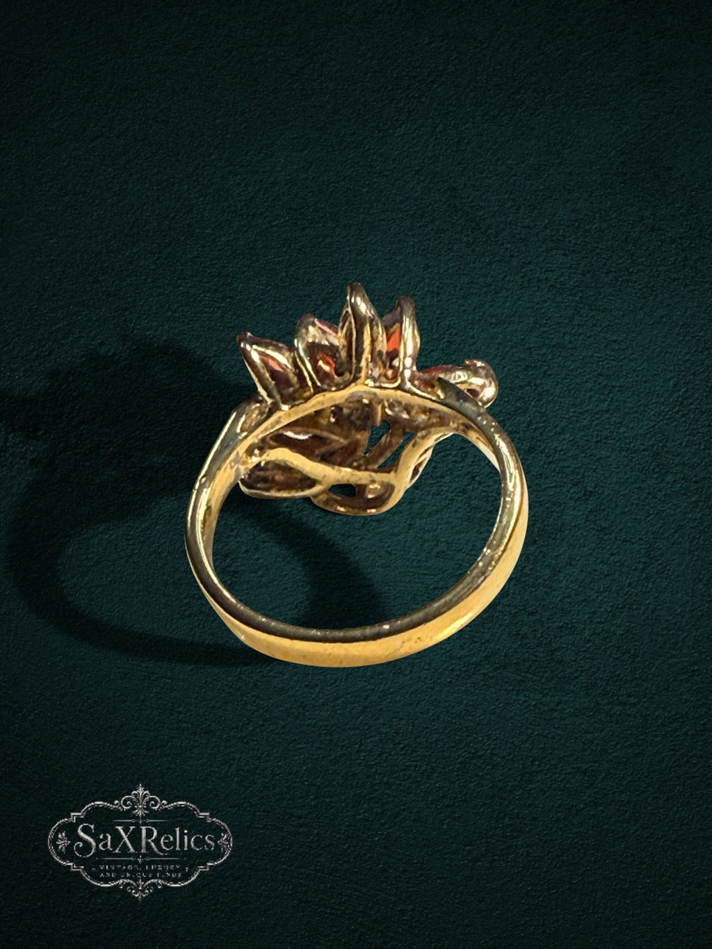 My Store vintage-inspired gold statement ring featuring marquise-cut red garnet stones and clear accent crystals.