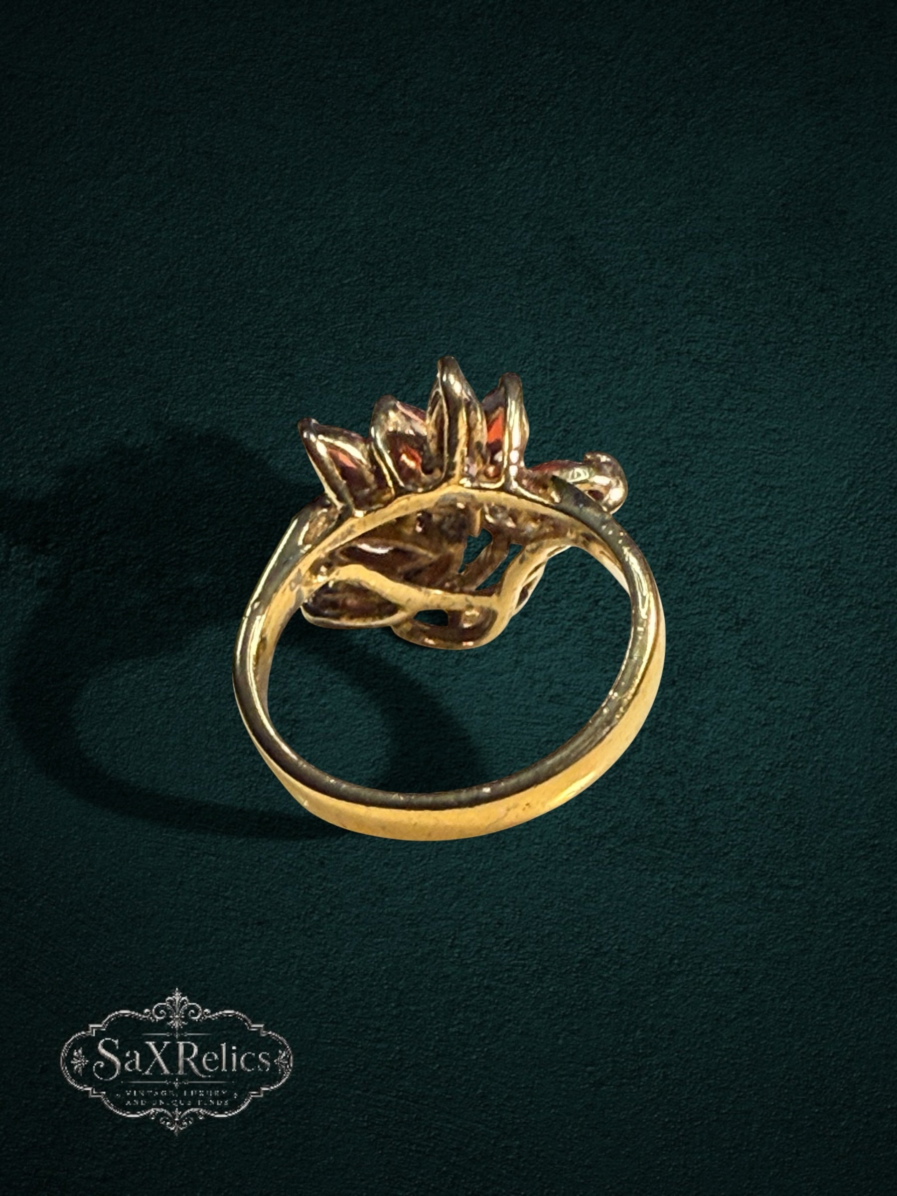My Store vintage-inspired gold statement ring featuring marquise-cut red garnet stones and clear accent crystals.