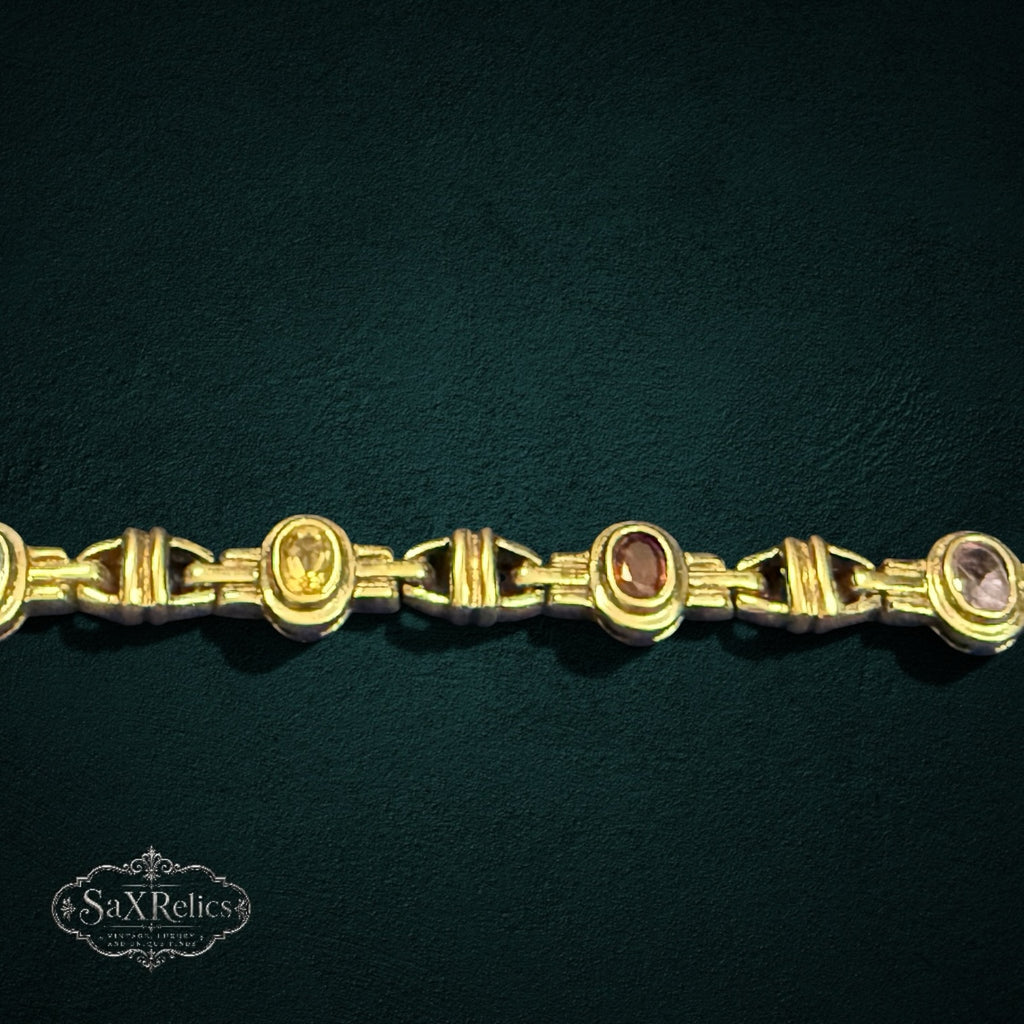 My Store SAXRelics vintage-inspired gold-tone link bracelet featuring oval-cut multi-colored gemstones.