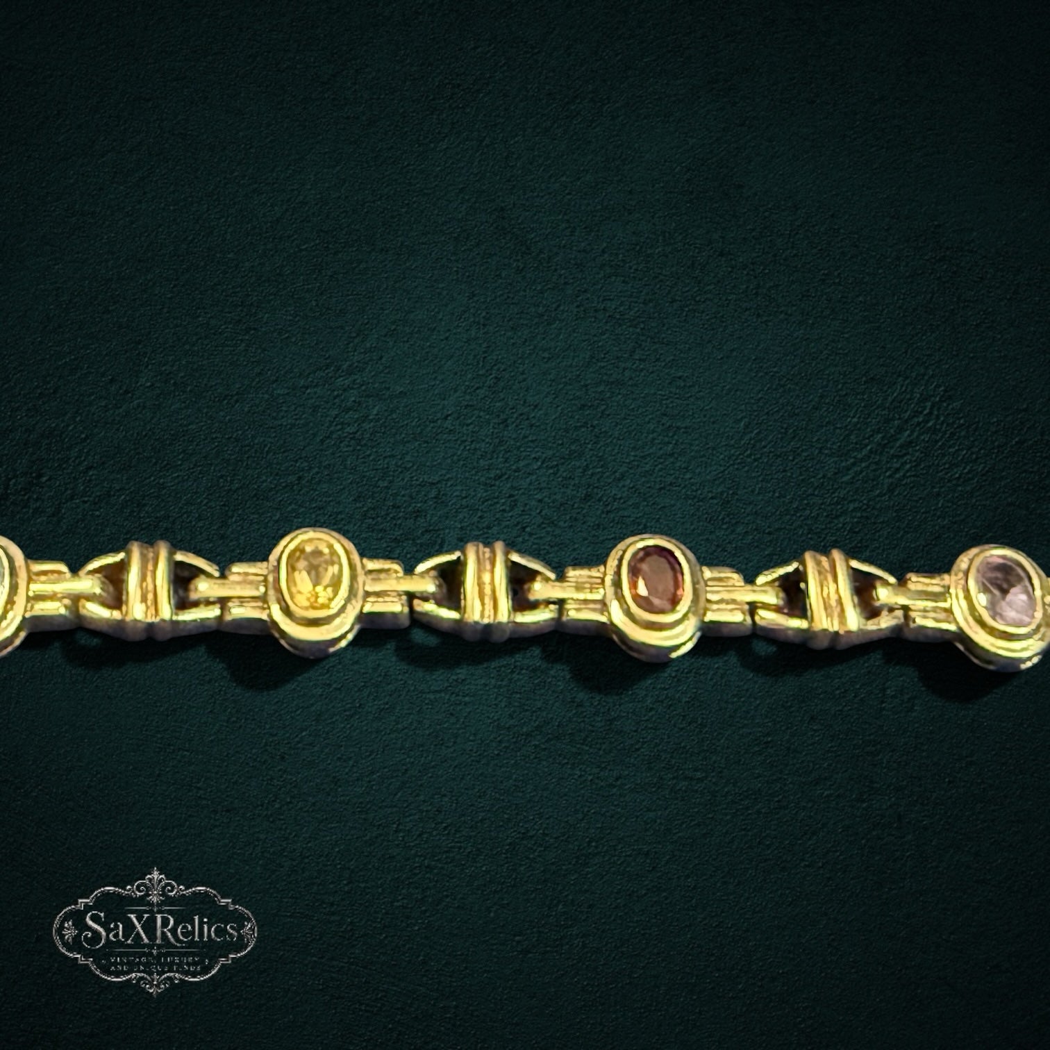 My Store SAXRelics vintage-inspired gold-tone link bracelet featuring oval-cut multi-colored gemstones.