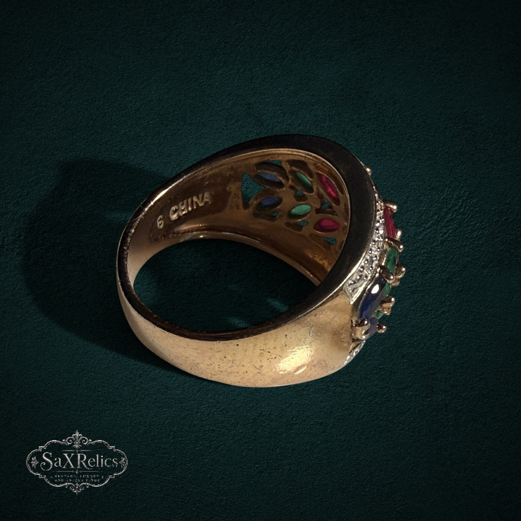 My Store statement ring featuring marquise-cut rubies, sapphires, and emeralds in a gold-tone band with leaf-inspired design