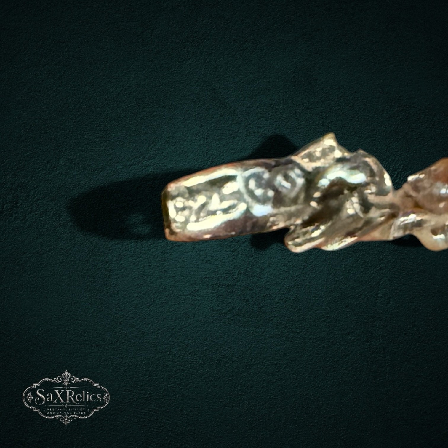 SaX Relics sterling silver bracelet detail showing marquise rubies and diamond chips on a dark background