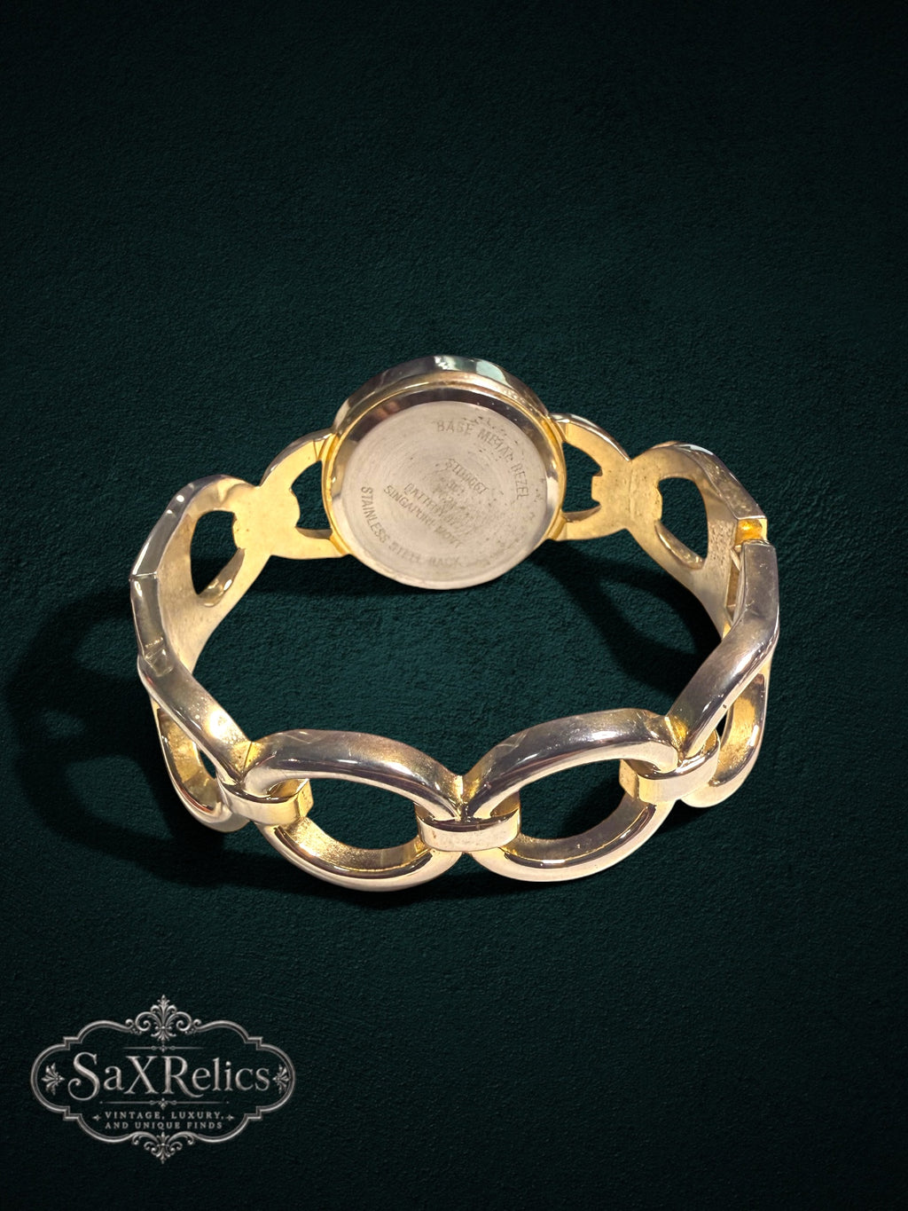 Back view of a My Store gold-tone link bracelet wristwatch showing the stainless steel case back and chain-link band.