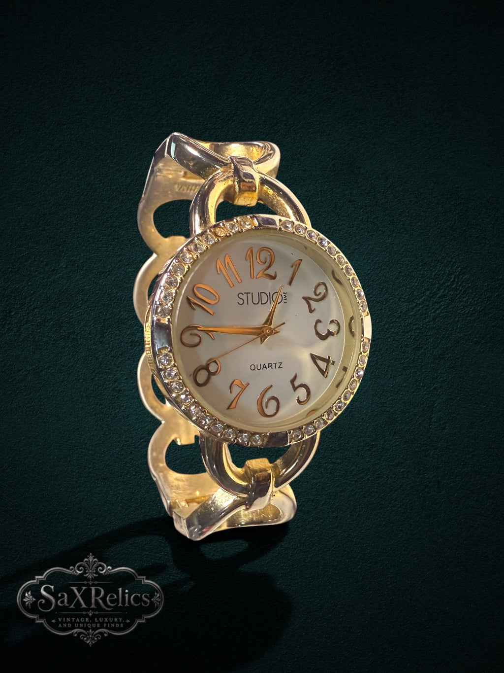 My Store gold-tone Studio Time quartz watch with a crystal-encrusted bezel and a unique chain-link bracelet.