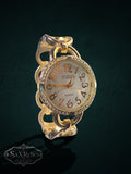 My Store gold-tone Studio Time quartz watch with a crystal-encrusted bezel and a unique chain-link bracelet.