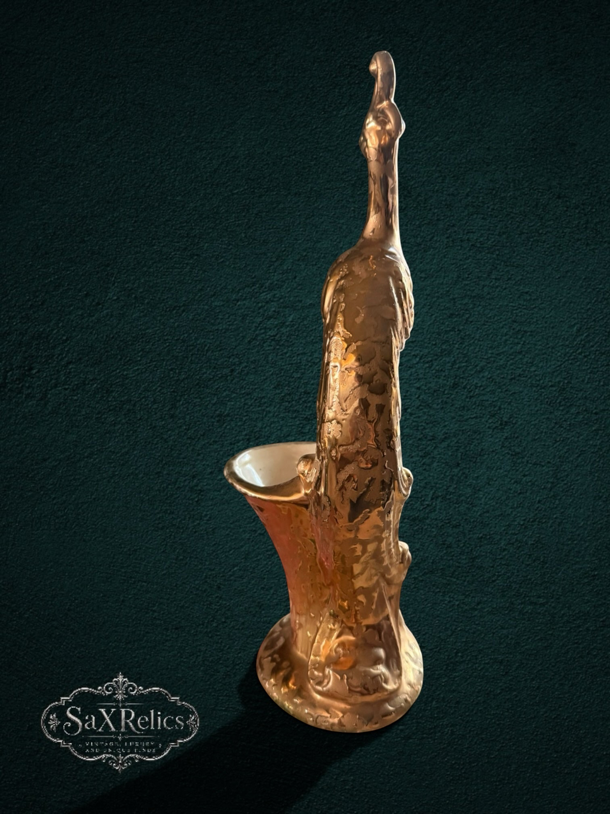 My Store decorative peacock figurine vase in shimmering gold glaze with intricate relief plumage on a dark background