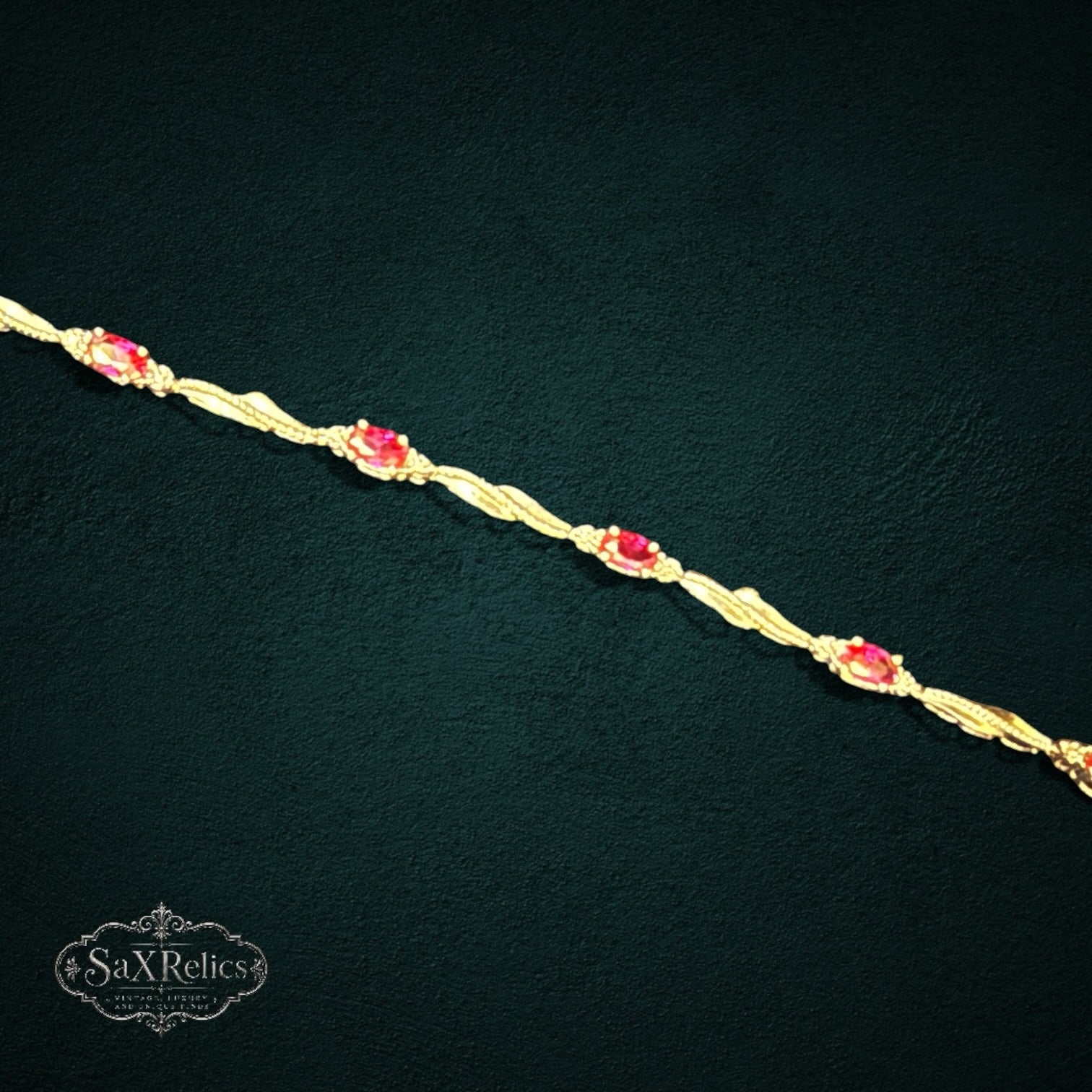 SaX Relics sterling silver link bracelet with marquise-cut rubies and twisted metalwork detail