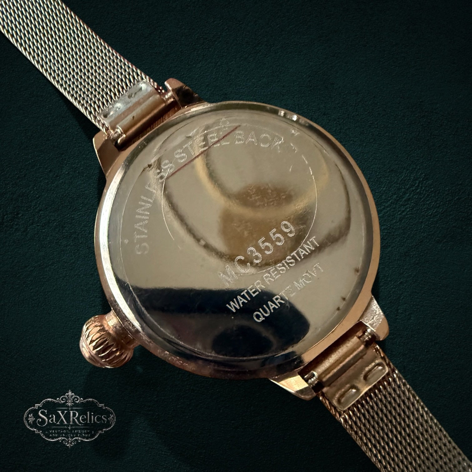 My Store gold-tone stainless steel watch case back with mesh strap and engraved details