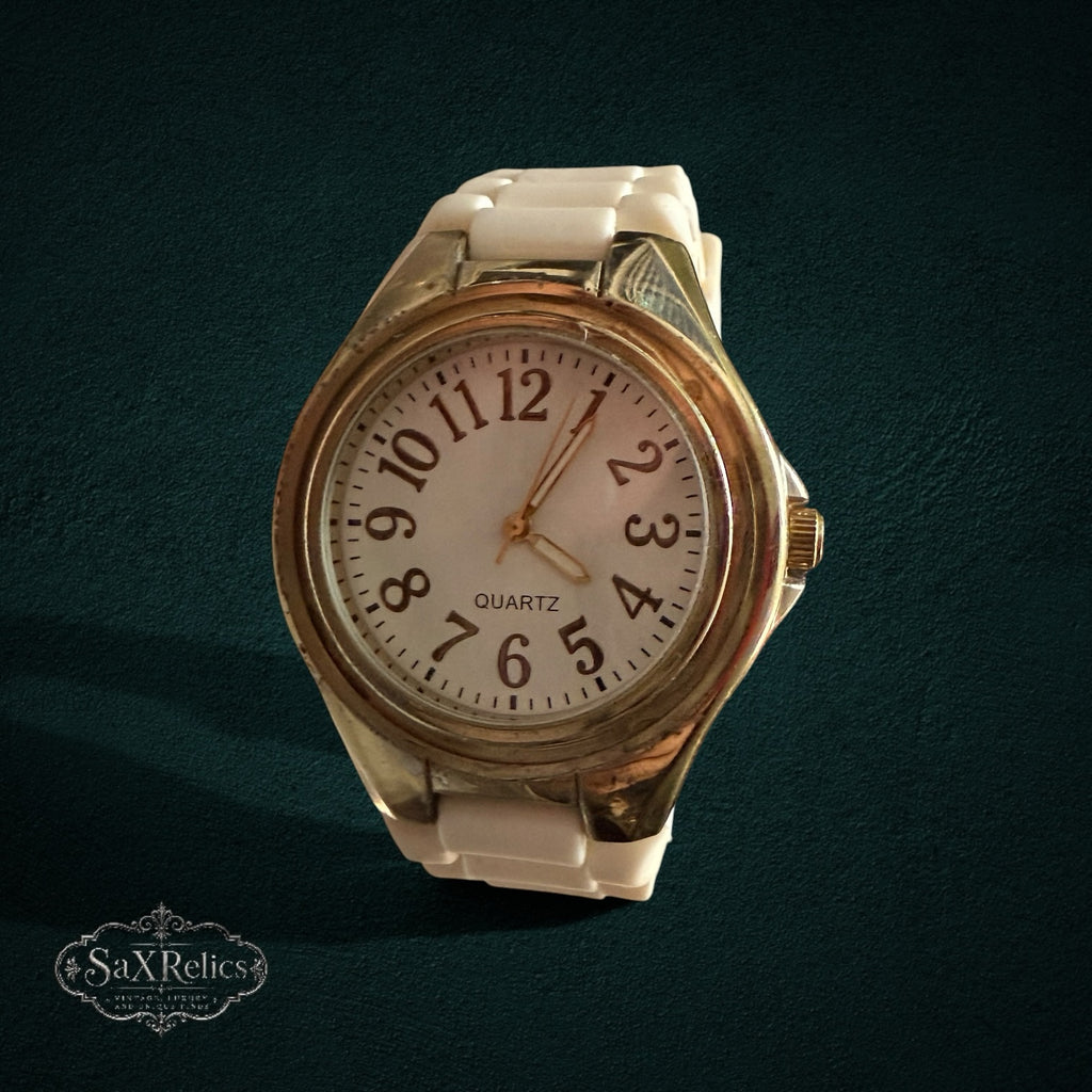 SaX Relics gold-tone bezel quartz watch with a white dial and white silicone band