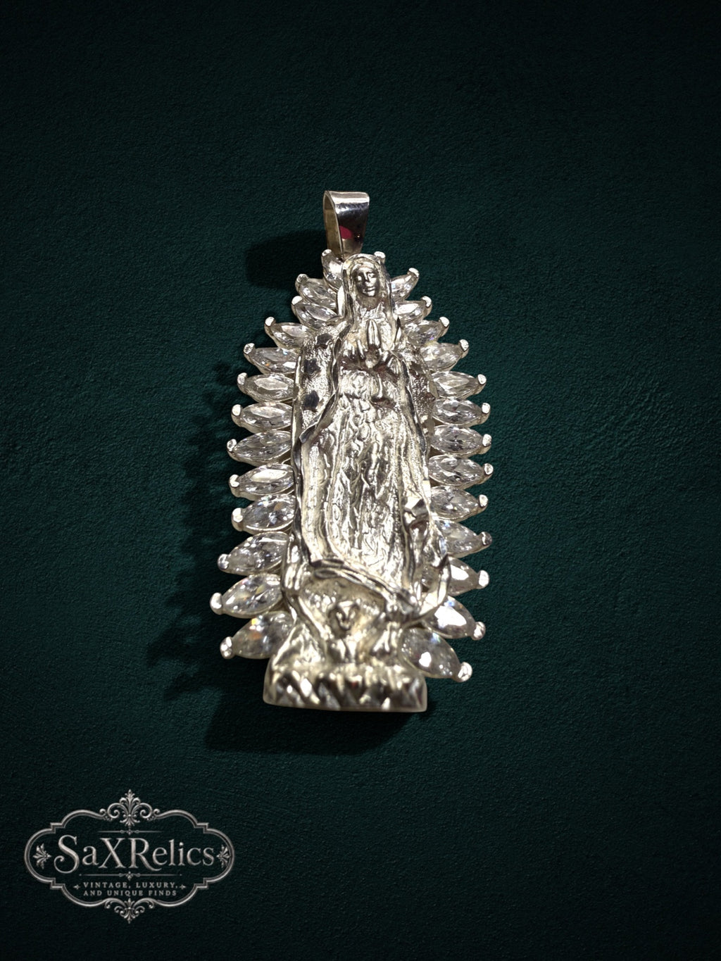 My Store sterling silver Our Lady of Guadalupe pendant with marquise-cut clear stones and a radiant halo design.
