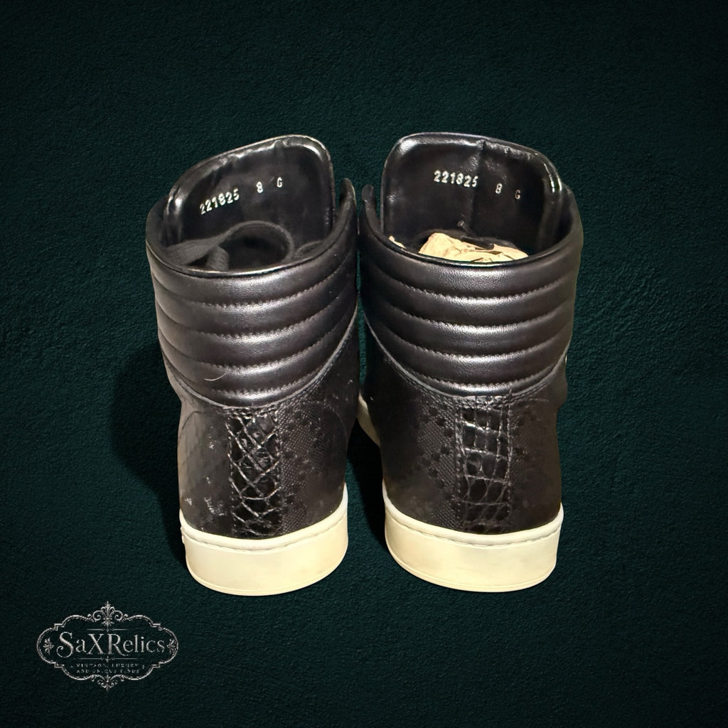 My Store Gucci black leather high-top sneakers featuring a textured heel panel and padded collar, rear view.