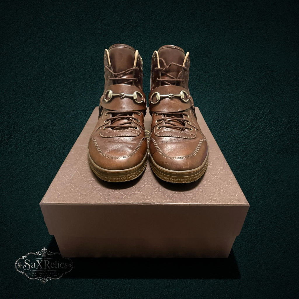 My Store Gucci brown leather high-top sneakers featuring signature gold-tone horsebit hardware and lace-up front.