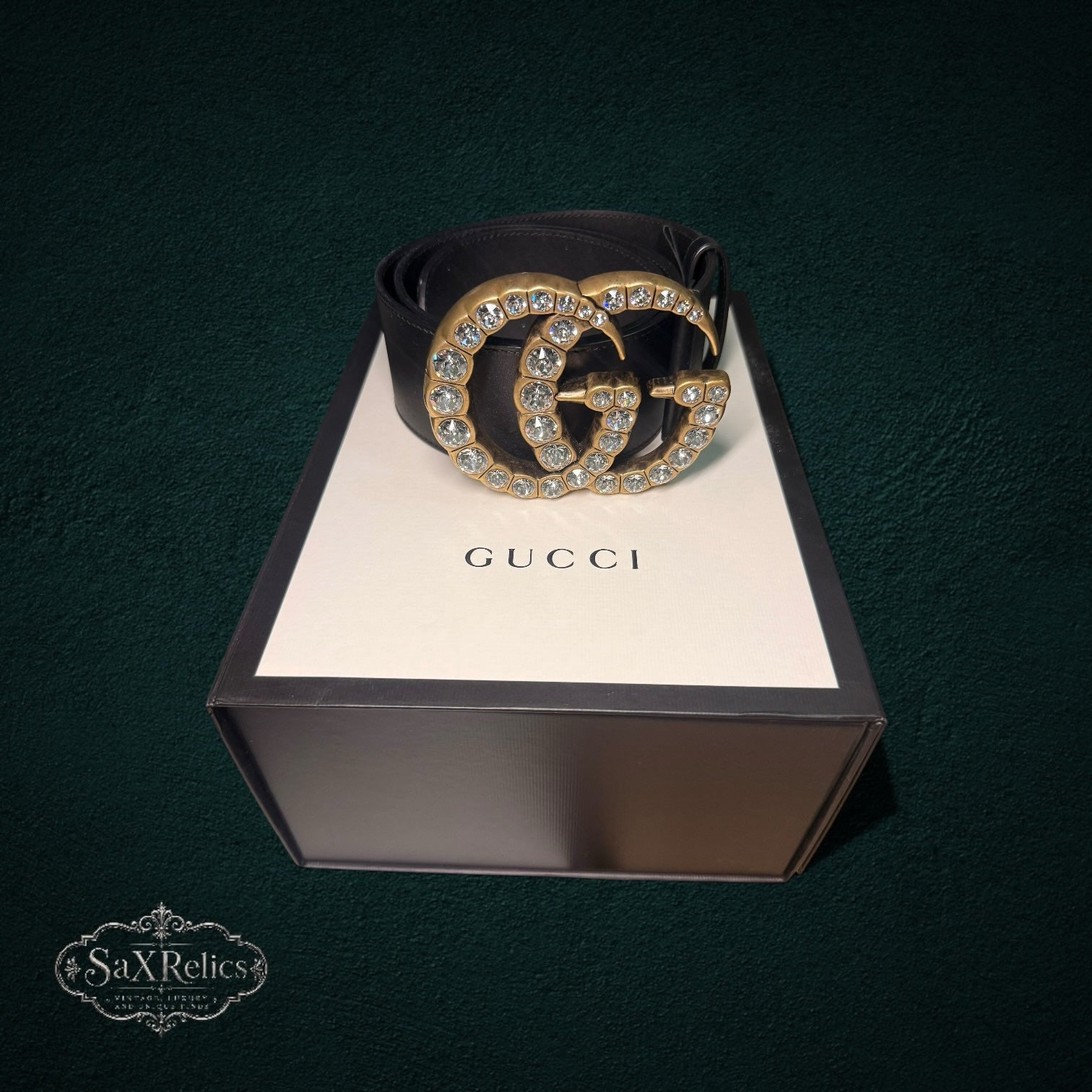 My Store Gucci black leather belt featuring an antique-gold Double G buckle embellished with sparkling crystals.
