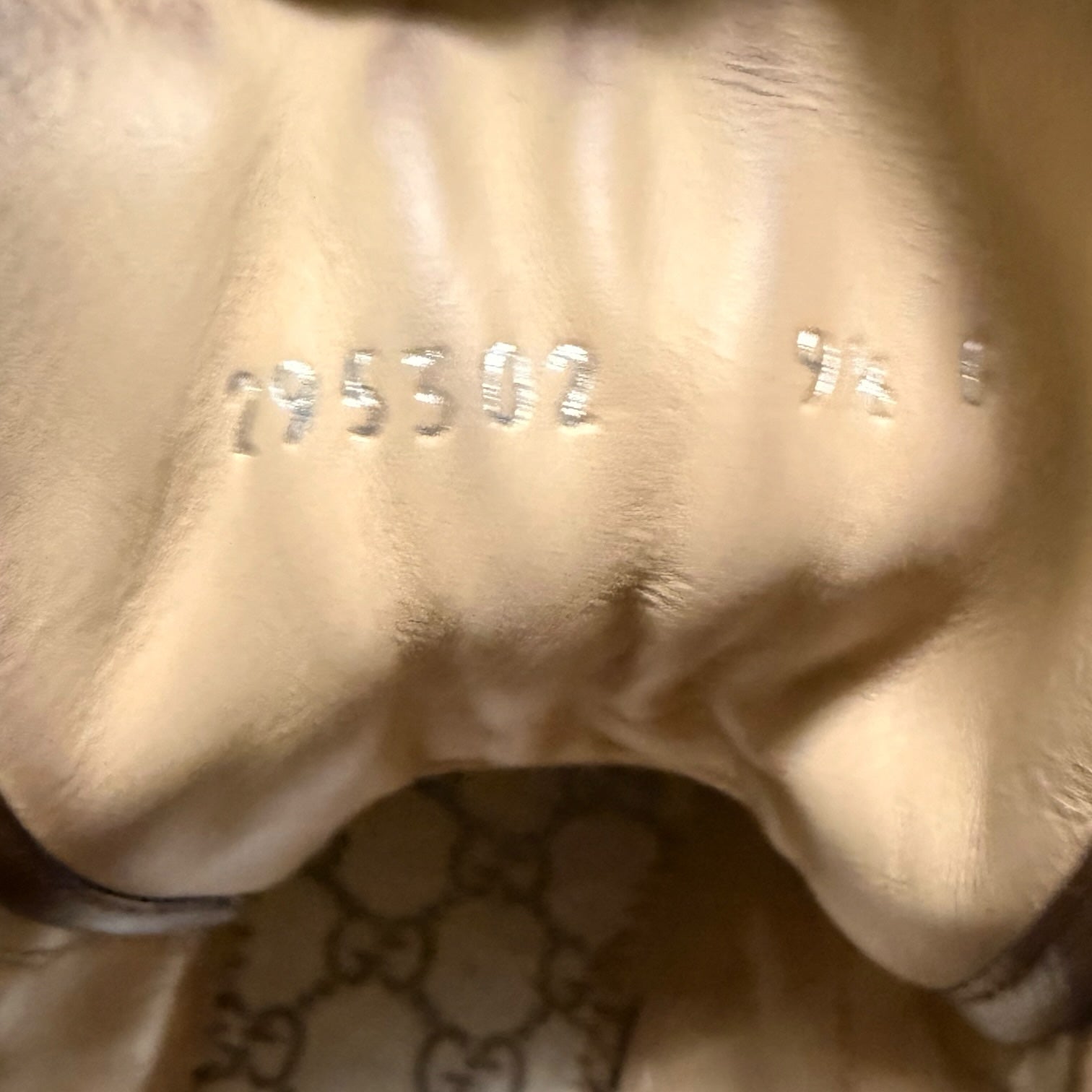 My Store Gucci leather high top sneaker interior showing embossed serial number and size detail