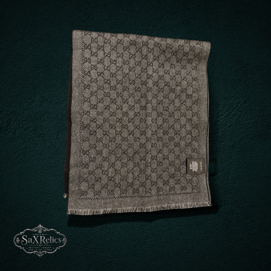 My Store Gucci grey and charcoal wool scarf featuring the iconic interlocking GG monogram pattern and fringe edges.