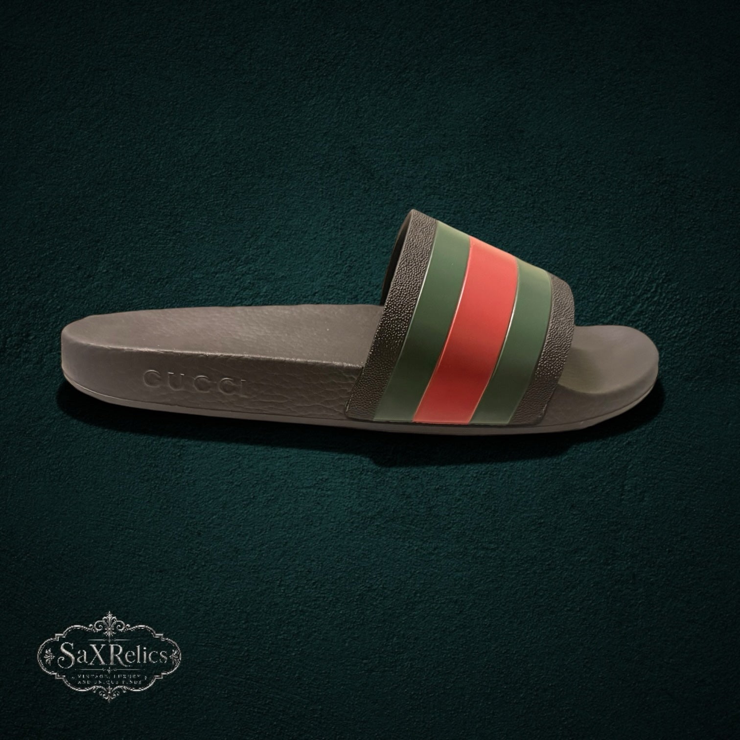 My Store GUCCI rubber slide sandals in black with iconic green and red web stripe and embossed side logo