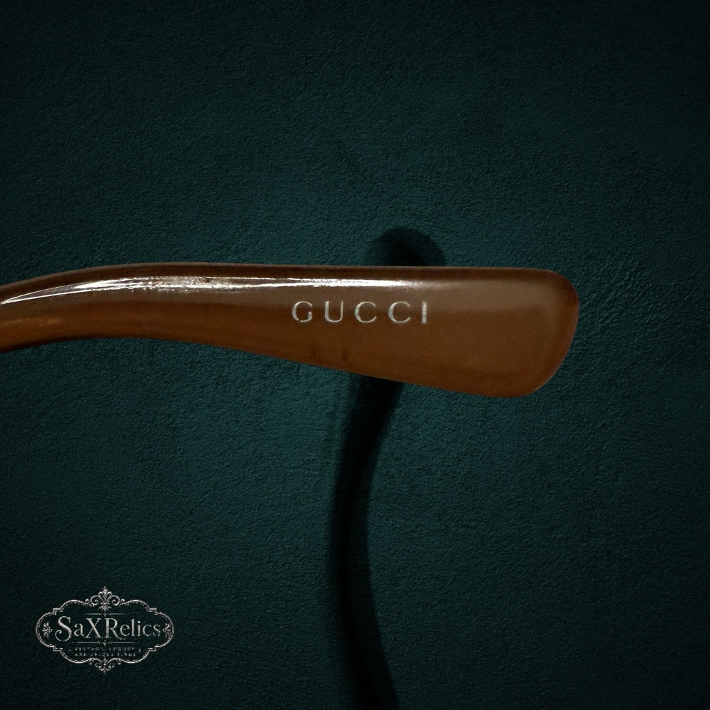 My Store vintage Gucci sunglasses temple detail in warm brown Optyl with engraved logo