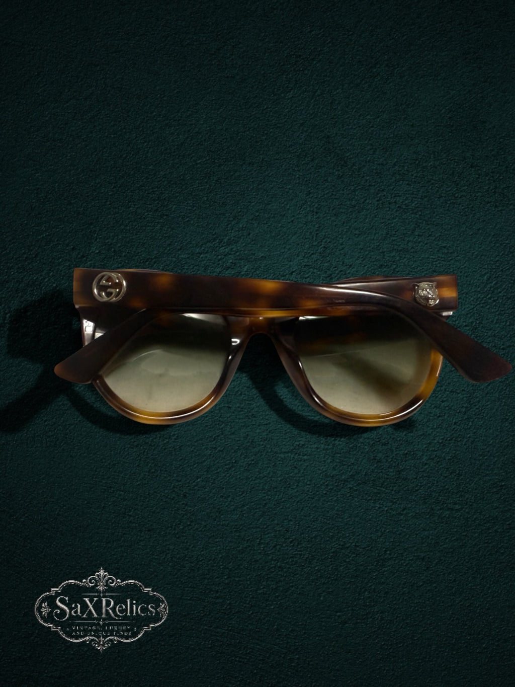 My Store Gucci tortoiseshell cat-eye sunglasses with gradient lenses, GG logo, and feline head temple accents.
