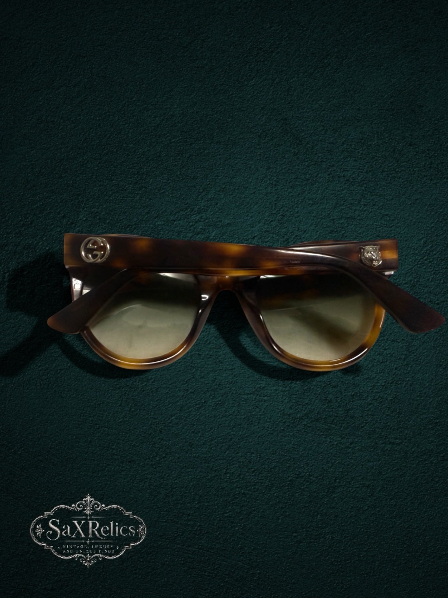 My Store Gucci tortoiseshell cat-eye sunglasses with gradient lenses, GG logo, and feline head temple accents.