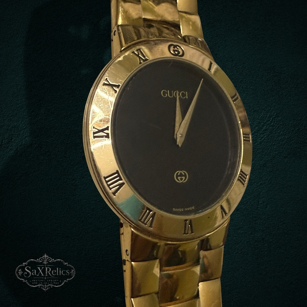 My Store vintage Gucci 3300M gold-tone wristwatch with a black dial and Roman numeral bezel