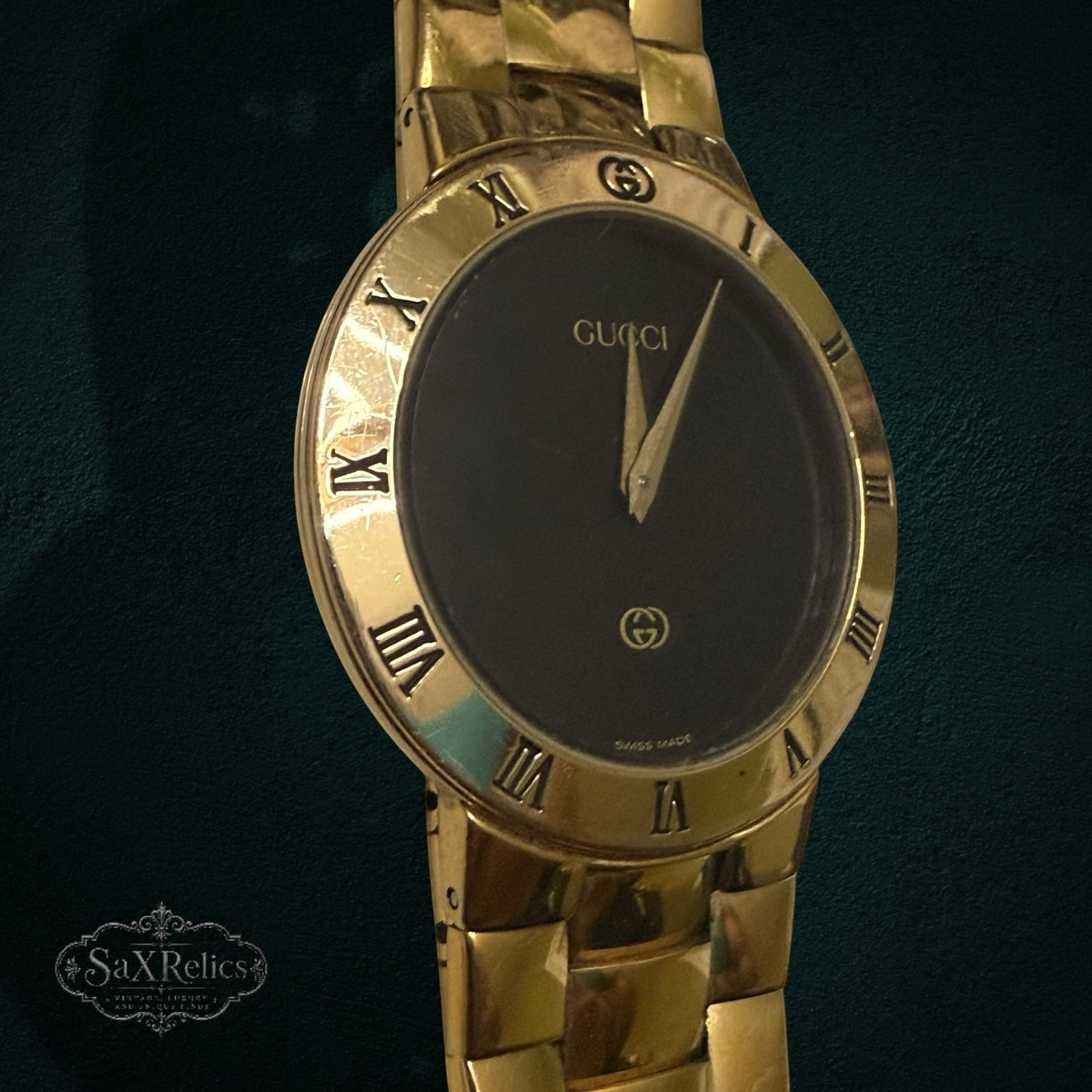 My Store vintage Gucci 3300M gold-tone wristwatch with a black dial and Roman numeral bezel