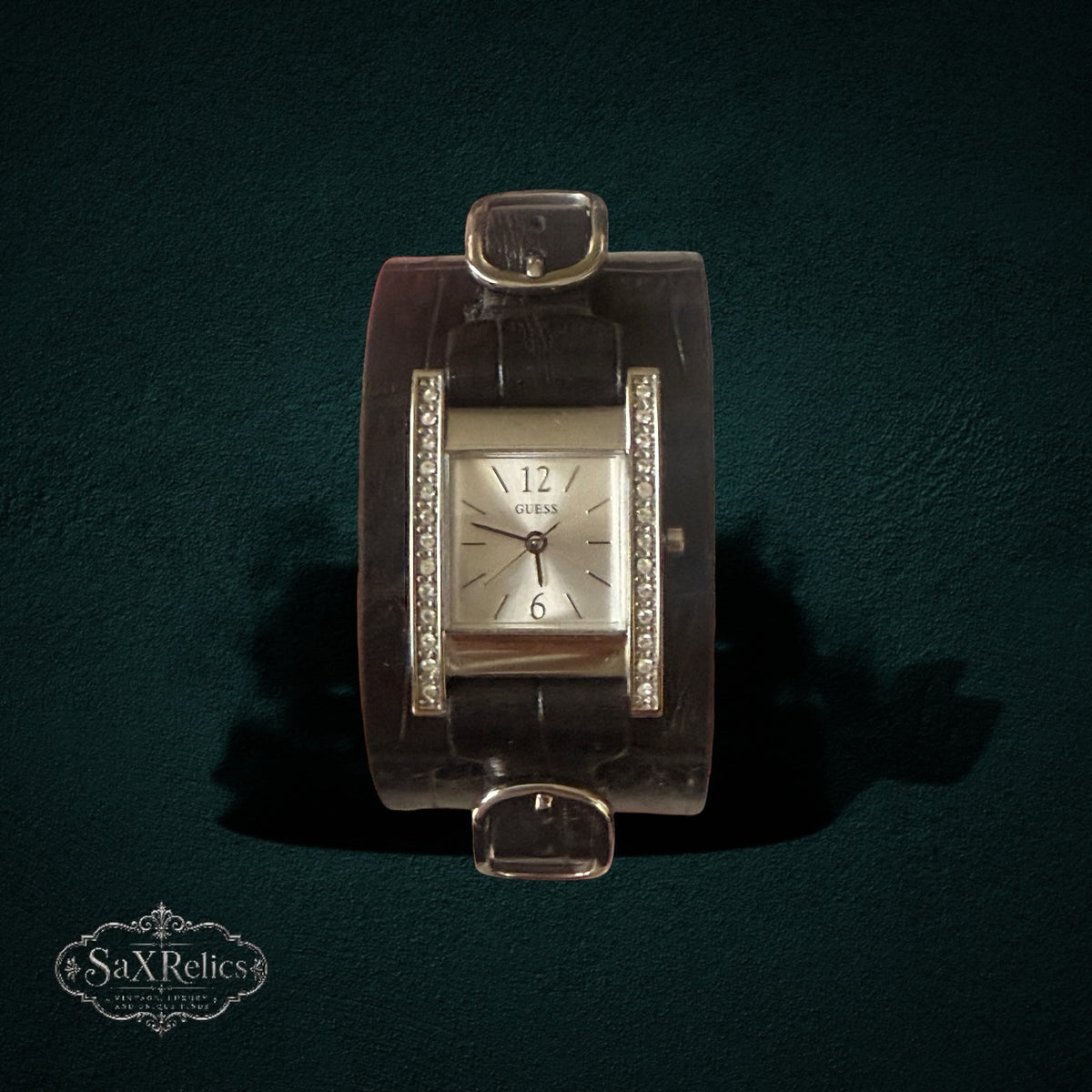 My Store GUESS rectangular silver-tone watch with crystal accents on a wide dark brown crocodile-embossed leather cuff