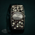 My Store STUDIO gunmetal cuff watch with an oval dial and ornate crystal-encrusted open-work band