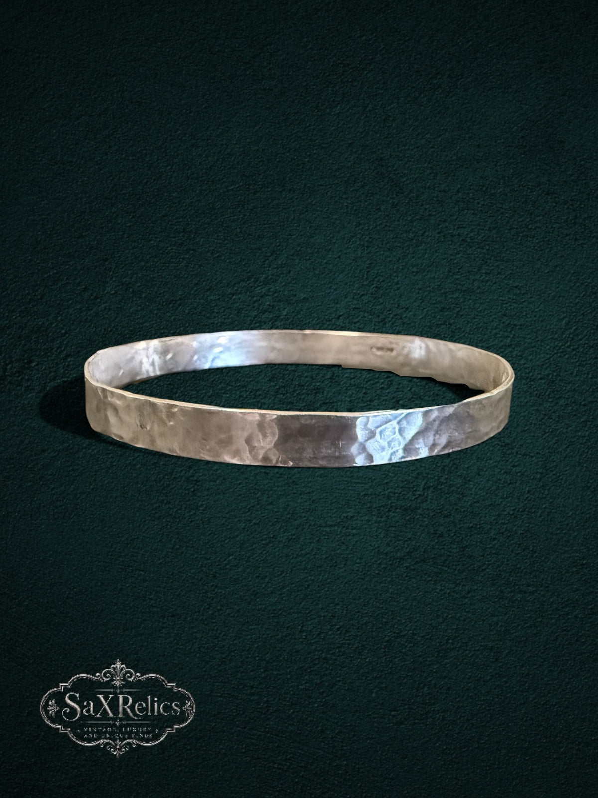 My Store handcrafted sterling silver bangle with a unique hammered texture and rustic artisanal finish