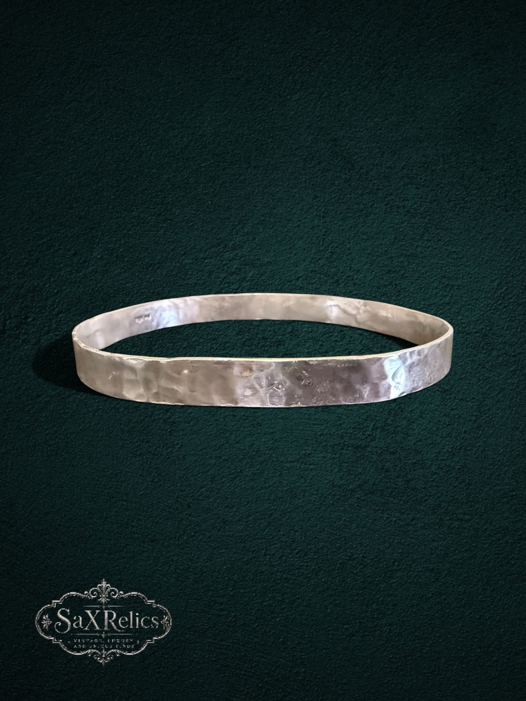My Store handcrafted sterling silver bangle with a unique hammered texture and rustic artisanal finish