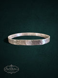 My Store handcrafted sterling silver bangle with a unique hammered texture and rustic artisanal finish