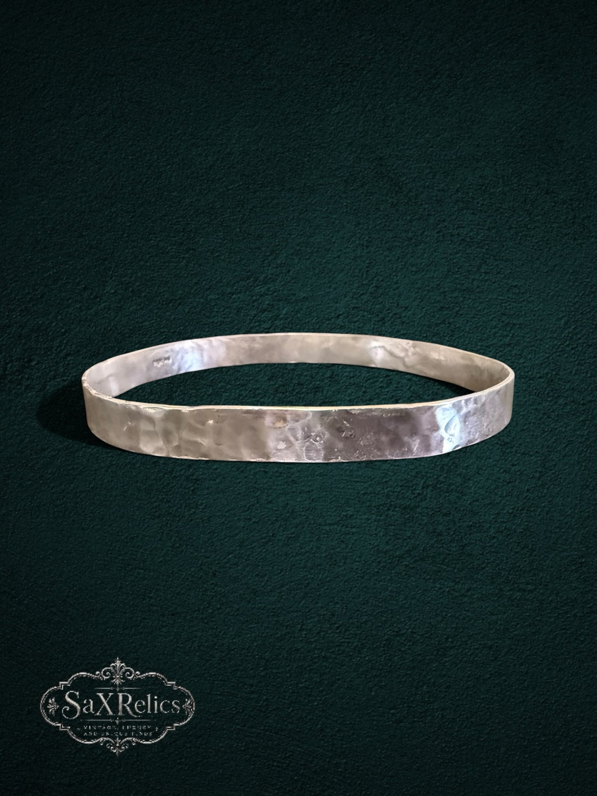 My Store handcrafted sterling silver bangle with a unique hammered texture and rustic artisanal finish