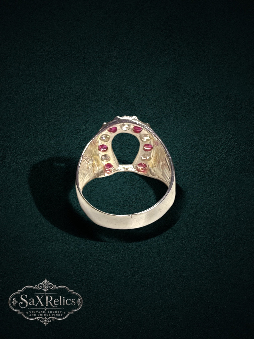 My Store sterling silver horseshoe statement ring featuring vibrant red rubies and clear stones with textured sides.