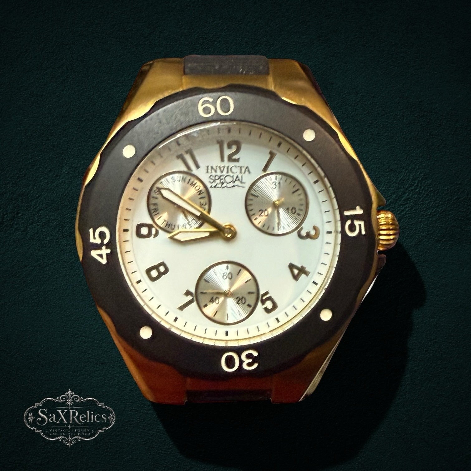 SaX Relics Invicta Angel 18797 multi-function watch on its black silicone strap