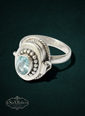 My Store sterling silver locket ring with an oval light blue gemstone, bead detailing, and twisted rope border.