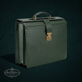 Vintage Louis Vuitton structured briefcase in forest green Taiga leather with brass hardware and lock closure.