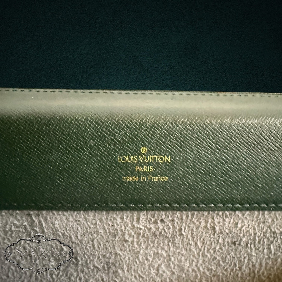 Vintage Louis Vuitton forest green Taiga leather briefcase with gold embossed logo and stitching detail