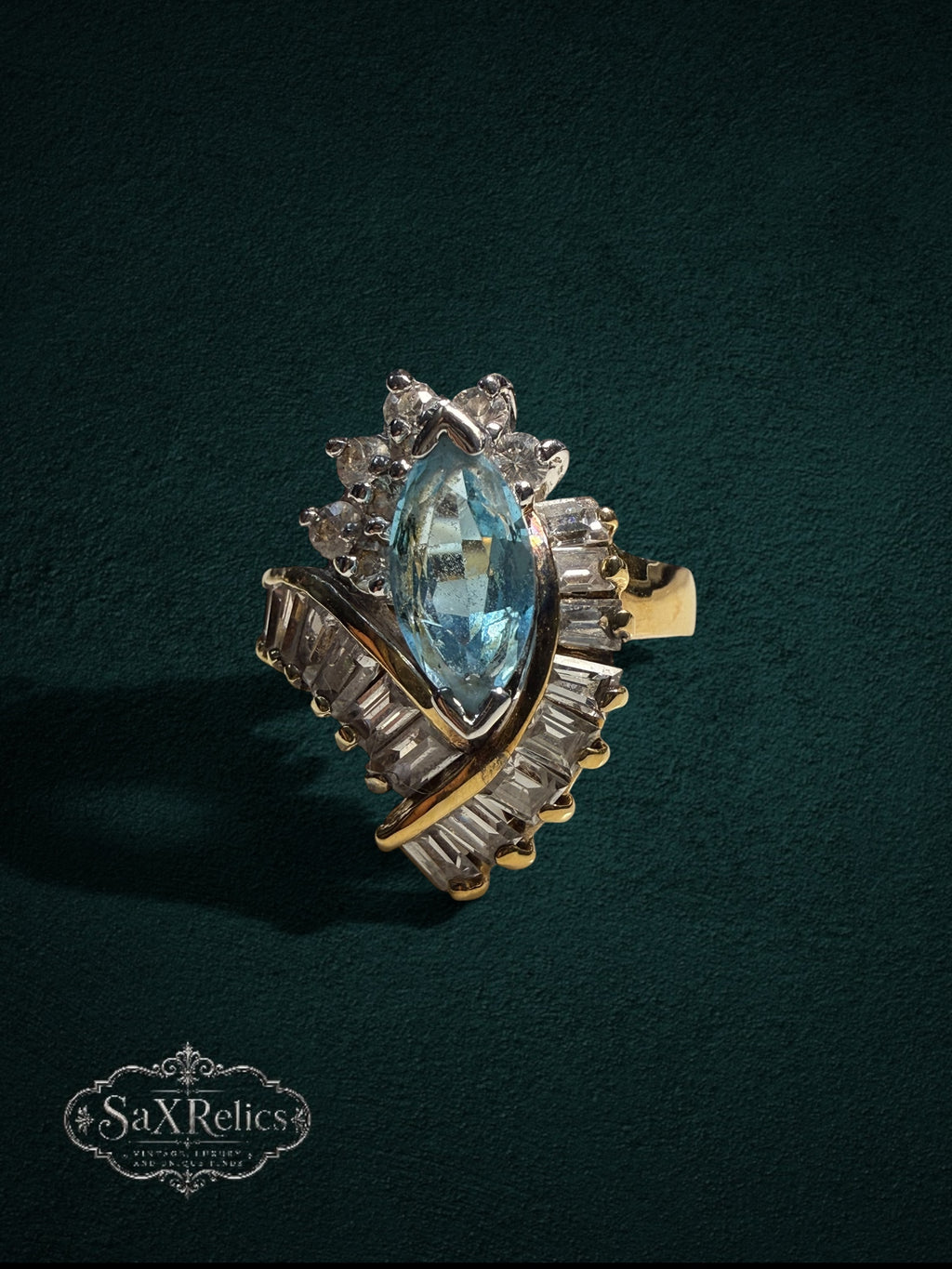 My Store SaxRelics vintage-inspired statement ring with a marquise-cut aquamarine stone and baguette-cut accents.