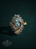 My Store SaxRelics vintage-inspired statement ring with a marquise-cut aquamarine stone and baguette-cut accents.